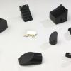 Various Mirror Blanks produced at Xactra.  We produce various custom configurations of mirror blanks that our customers diamond turn.  The component in the center shows an example that has been diamond turned as a finished mirror.